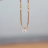 grey beaded necklace with moon