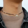 grey beaded necklace with moon